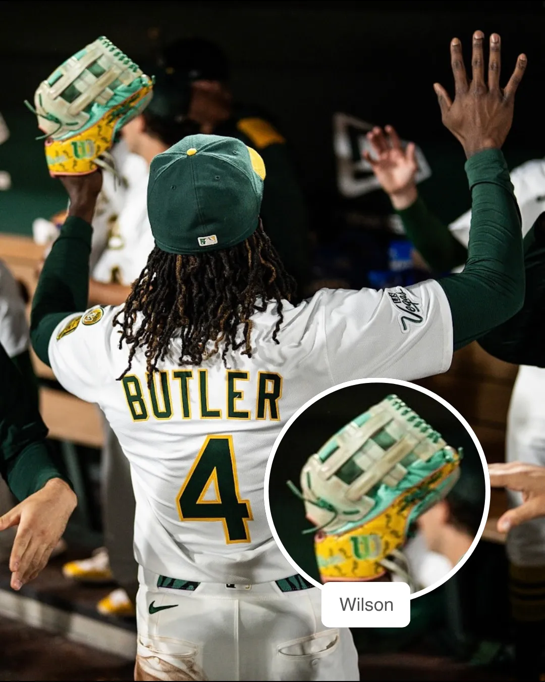 Lawrence Butler making a play in the outfield with his Wilson glove